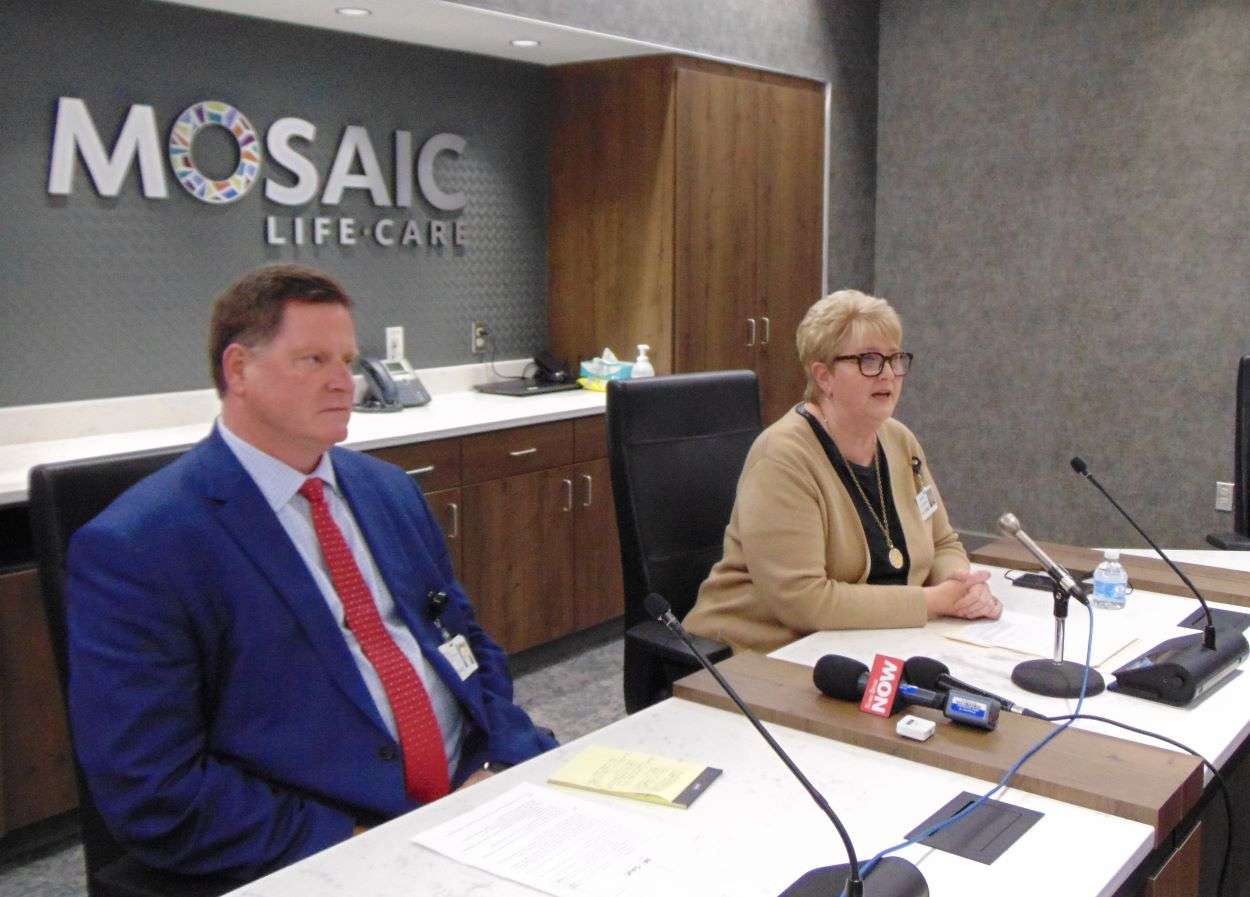 Mosaic Life Care Board of Trustees chair, Serena Naylor, addresses the news media as interim CEO Mike Poore listens/Photo by Brent Martin