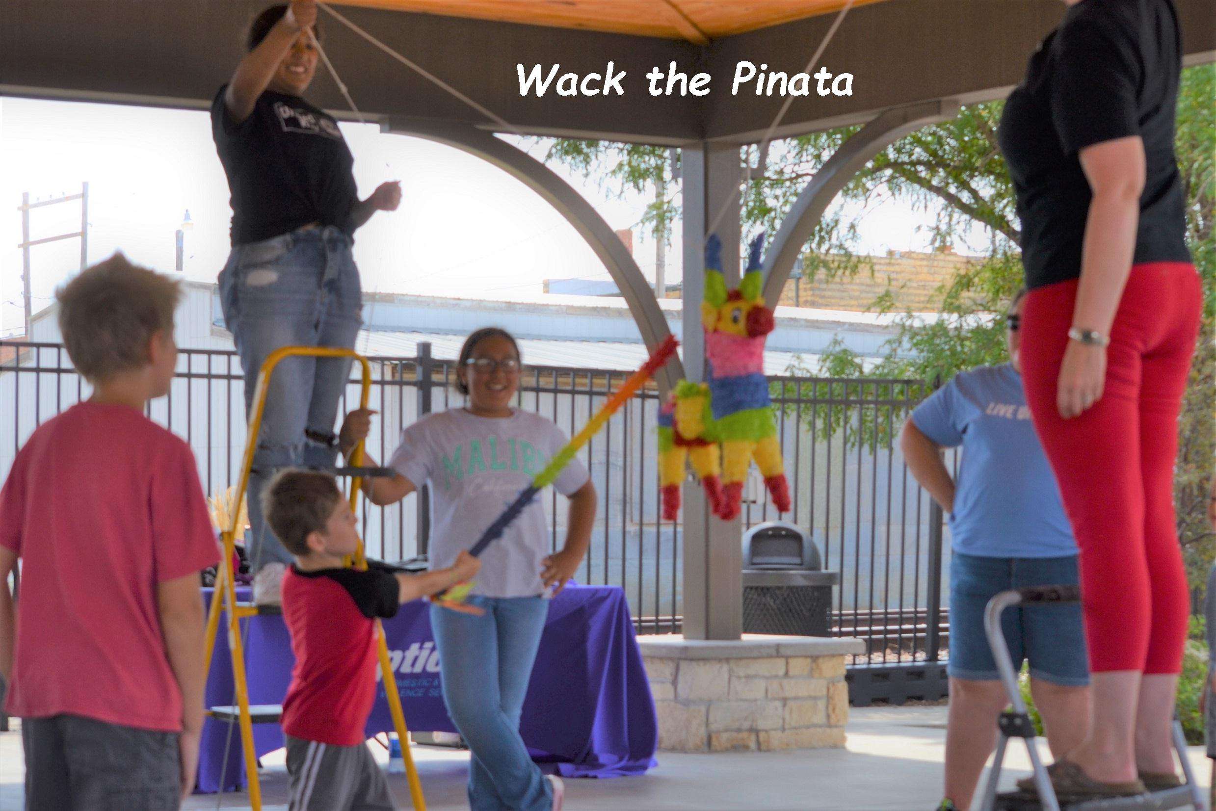 A child enjoying a piñatas at last year's  Tardeada. Courtesy photo.<br>