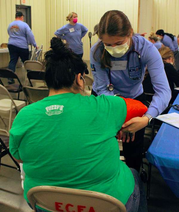 A Hays nursing student takes a Mission of Mercy patient's vitals Friday during the free dental clinic. Both FHSU and NCK Tech nursing students volunteered at the clinic Friday and today. Photo by Cristina Janney / Hays Post