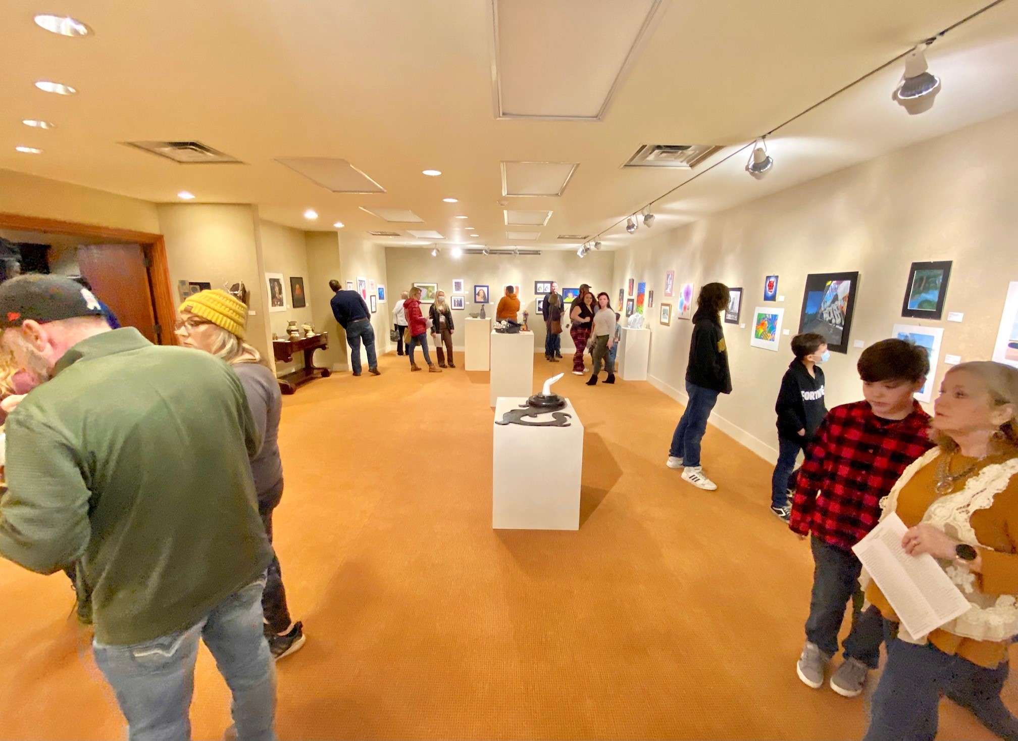 Visitors to the Albrecht-Kemper Museum of Art take in 2022 Regional High School Exhibition/Photo courtesy of Albrecht-Kemper Museum of Art