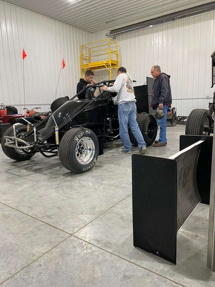 L-R Josh Jecha, Jake Martens, Craig Jecha building car in the Shop in rural Timken