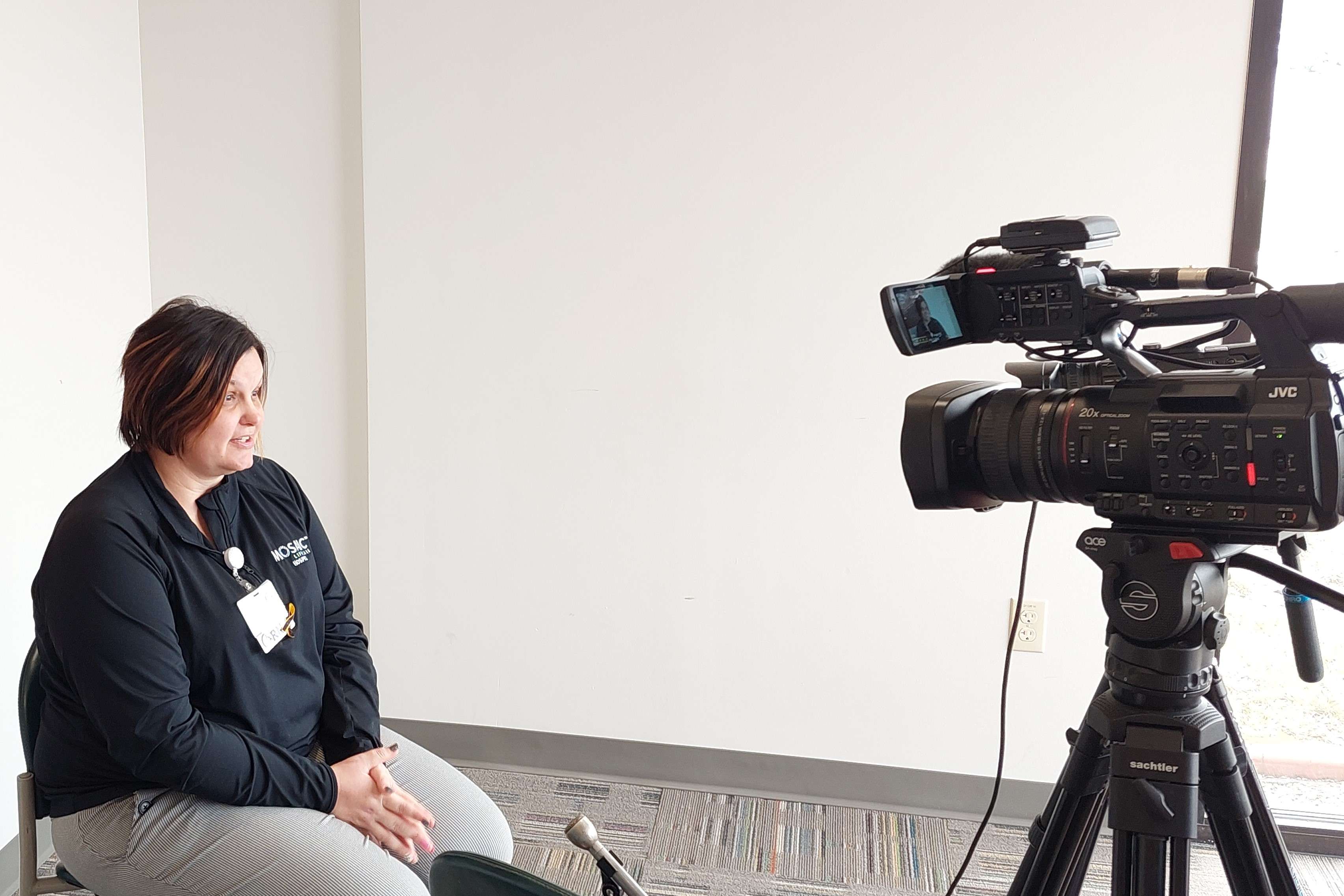 Director of Hospice Kassie Hodge talks to reporters at the Mosaic Hospice offices/Photo by Matt Pike