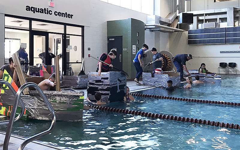 Monica Dreiling's students participate in cardboard boat races at the Center of Health Improvement. Courtesy photo.<br>