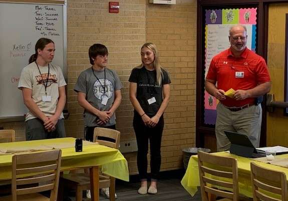 GBHS state champion wrestlers with principal Tim Friess