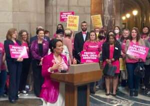 State Sen. Jen Day of Gretna spoke at a rally of opponents of a ‘trigger’ abortion bill in April. (Paul Hammel/Nebraska Examiner)