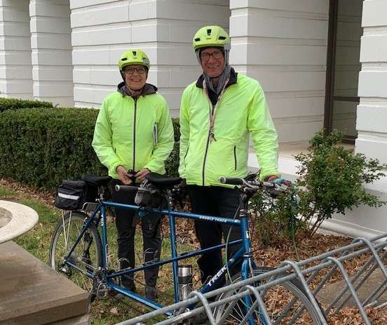 K-State's Cottonwood Extension District Director Donna Krug and husband John getting ready to pedal away from Wednesday's county commission meeting.