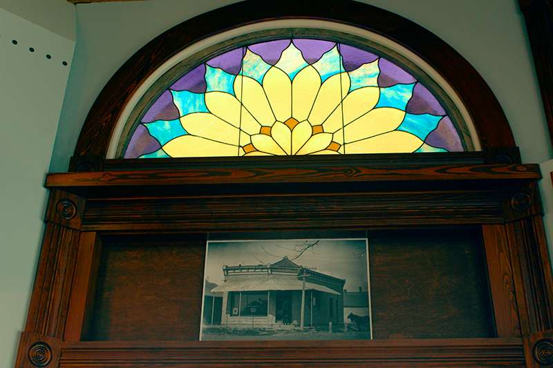 After traveling across multiple states, the original stained glass window that was above the entrance of the Dorrance State Bank was reinstalled. Photo by Cristina Janney/Hays Post<br>