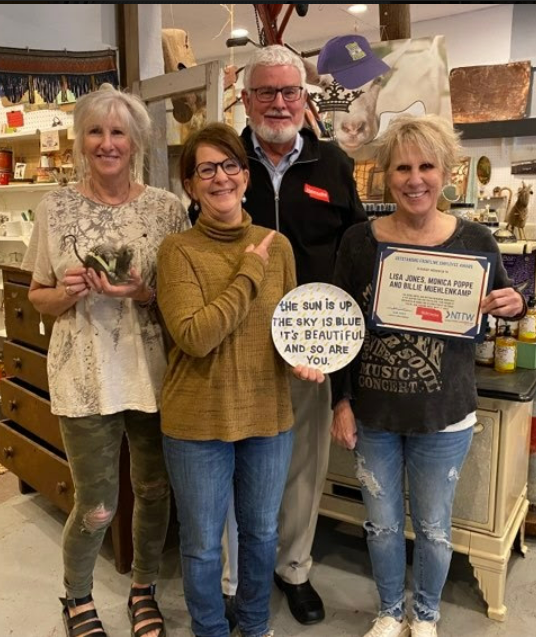 Lisa Jones, Monica Poppe and Billie Muehlenkamp of Soulful Salvage with Nebraska Tourism executive director, John Ricks.