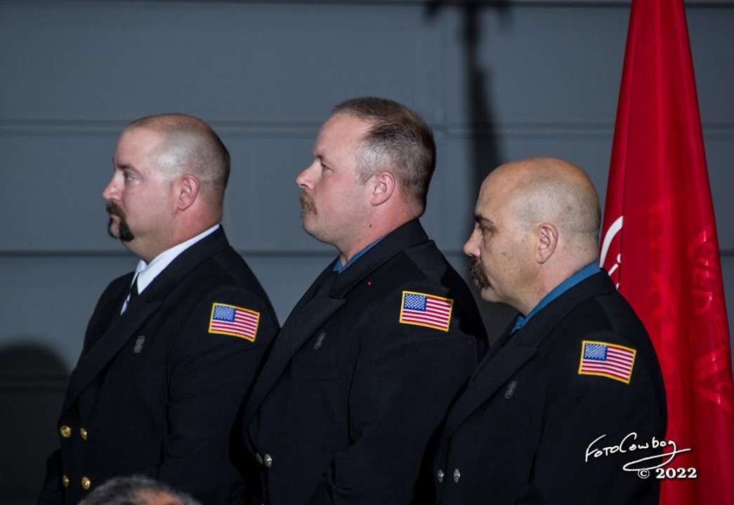 Hutchinson Fire Department's Justin Holzrichter, Tim Morris and Raymond Casanova are honored during a promotion ceremony held May 6.