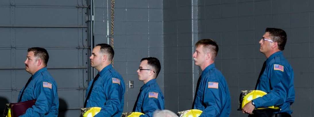 Matt Barr, Brant Graves, Nick Hood, Kolton Miller and Cale O'Hair are sworn in as new members of the Hutchison Fire Department.