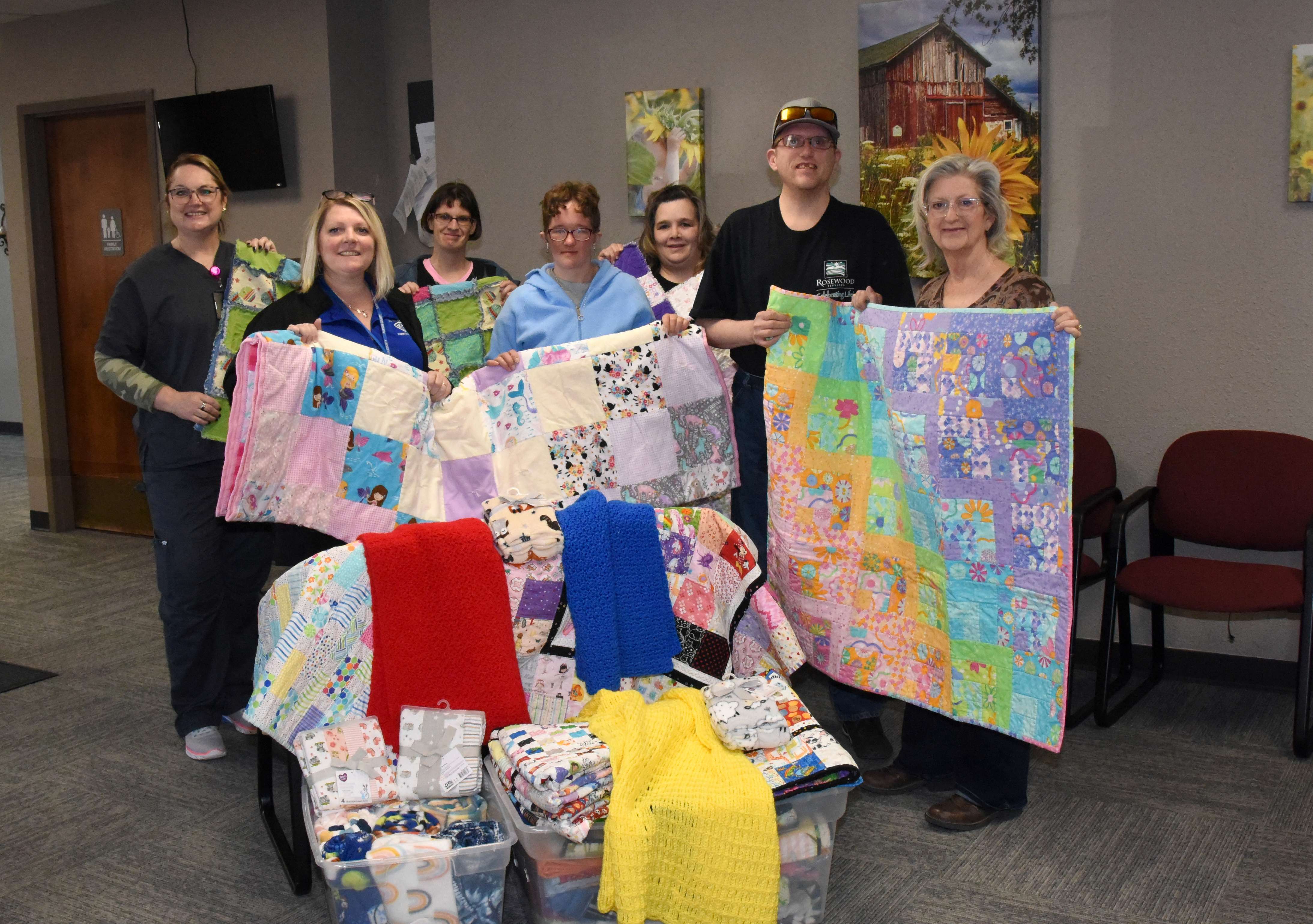 Rosewood Miracle Workers AKTION Club members are photographed along with Barton County Health Department representatives with blankets donated by the community during the AKTION Club blanket drive conducted from January through March. Pictured left to right are Debra Higgins, RN (public health nurse); Christy Huslig (Healthy Start home visitor); Alex Randall; Abbey Stanley; Frankie Pelster (AKTION Club sponsor); Jonathan Howe; and Tonya Burton (AKTION Club sponsor assistant).
