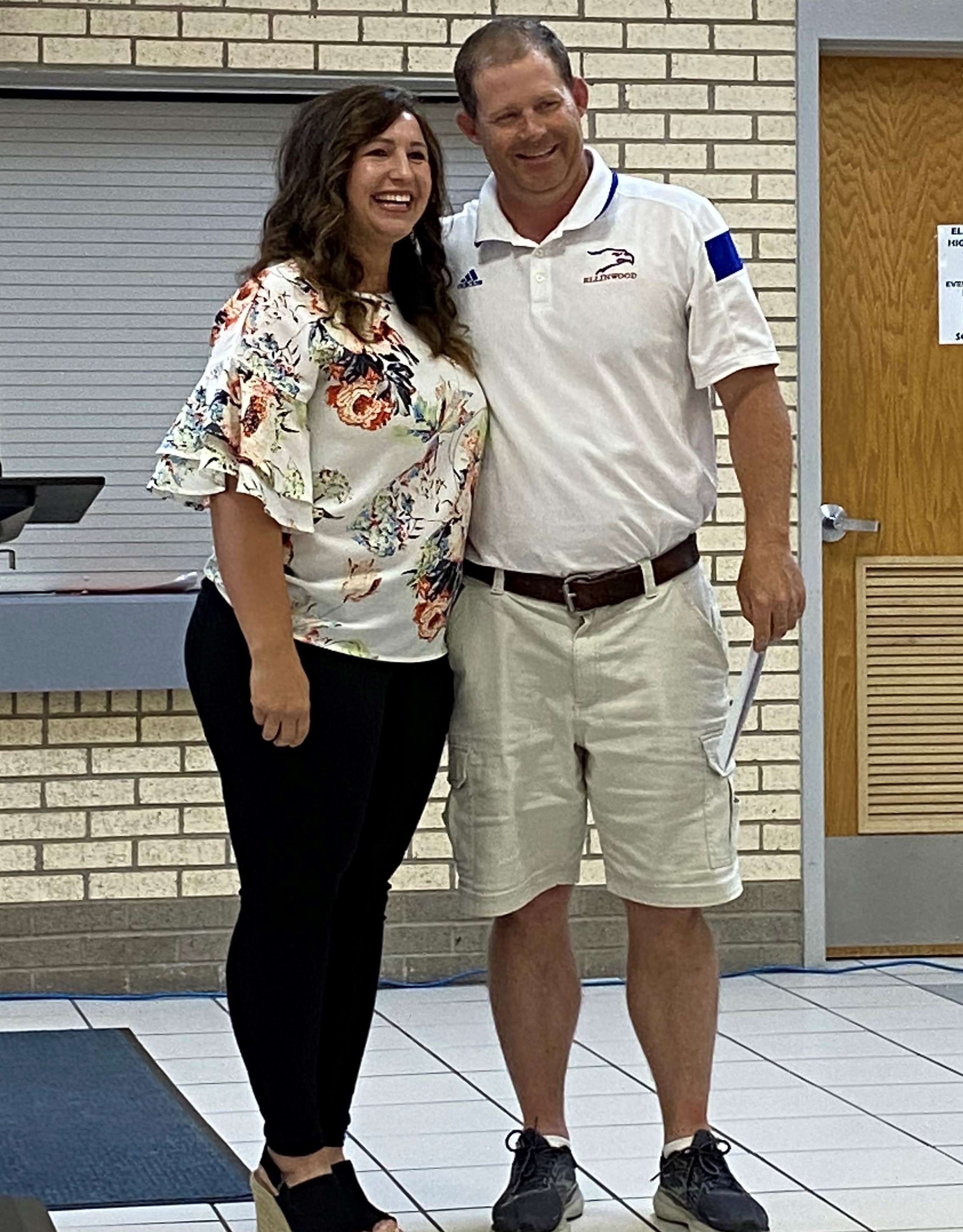 President of the Ellinwood Public Education & Library Foundation Sarah Salem with Educator of the Year Greg Maxwell.