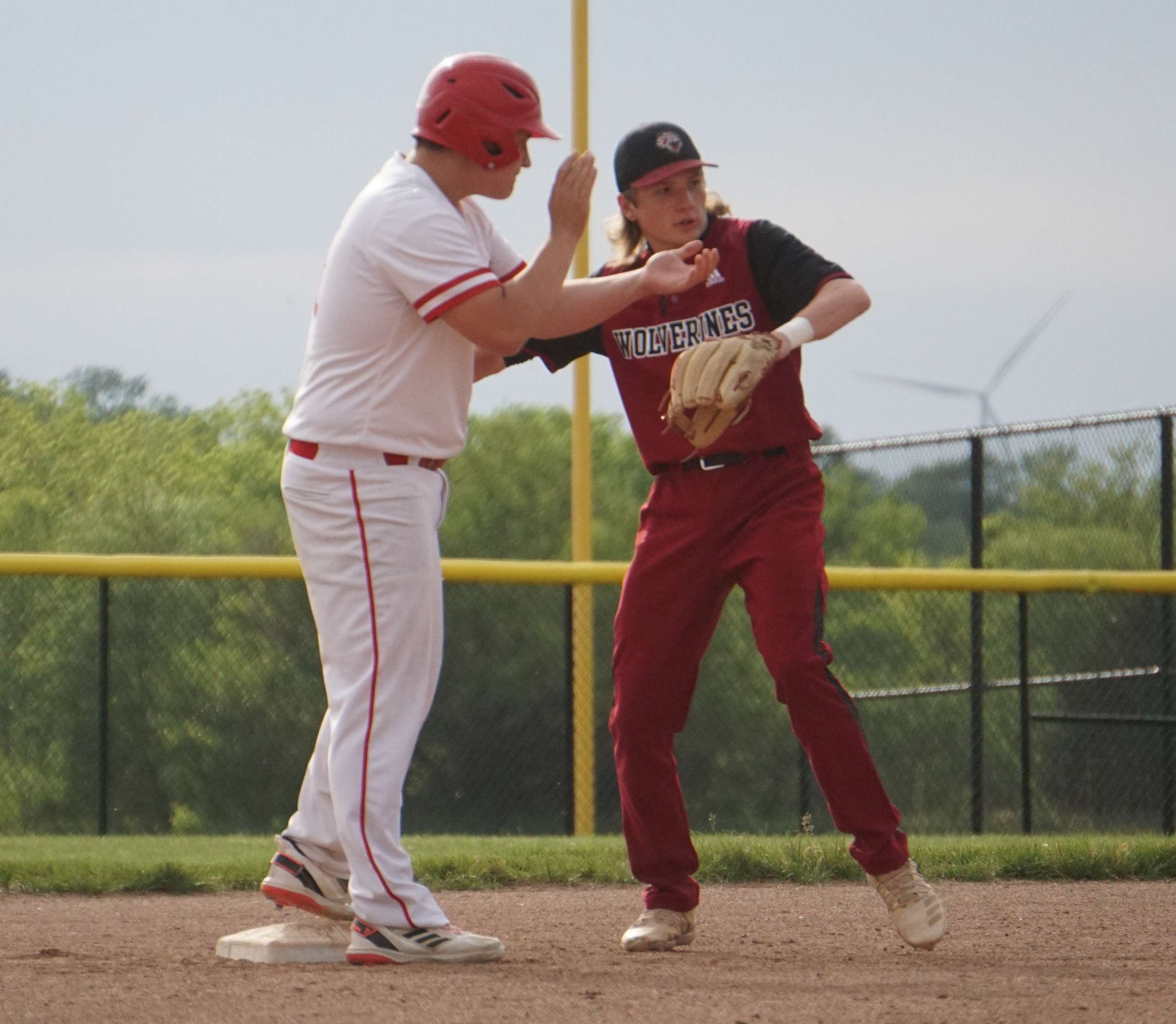 Jackson Lewis (left) celebrates after hitting an RBI double in the first.