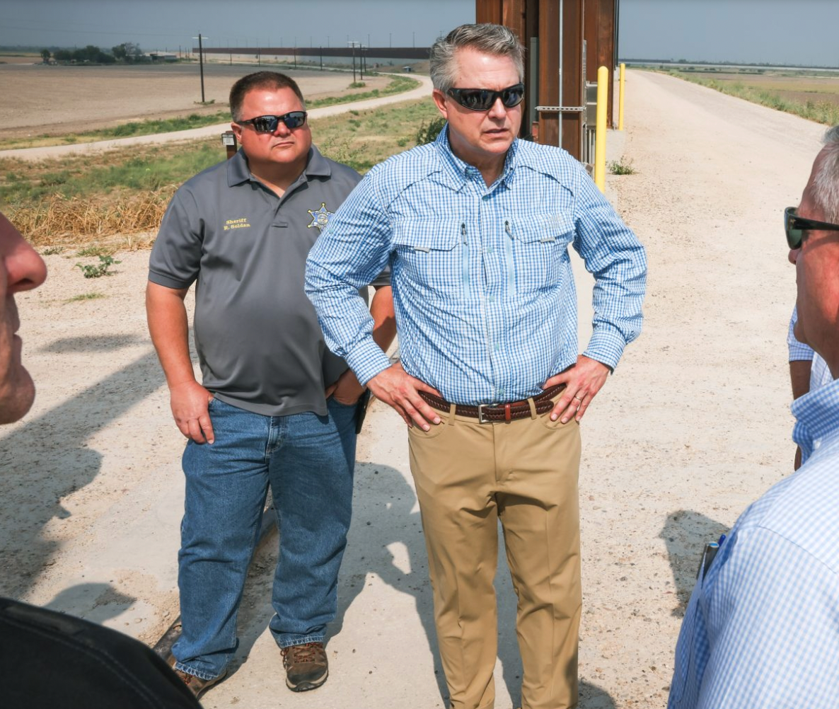 <b>U.S. Senator Roger Marshall, center, and select Kansas sheriffs, including Saline County Sheriff Roger Soldan (standing behind the senator) receive a briefing from a local farmer who is dealing with the border crisis.</b> Photos courtesy U.S. Senator Roger Marshall's office