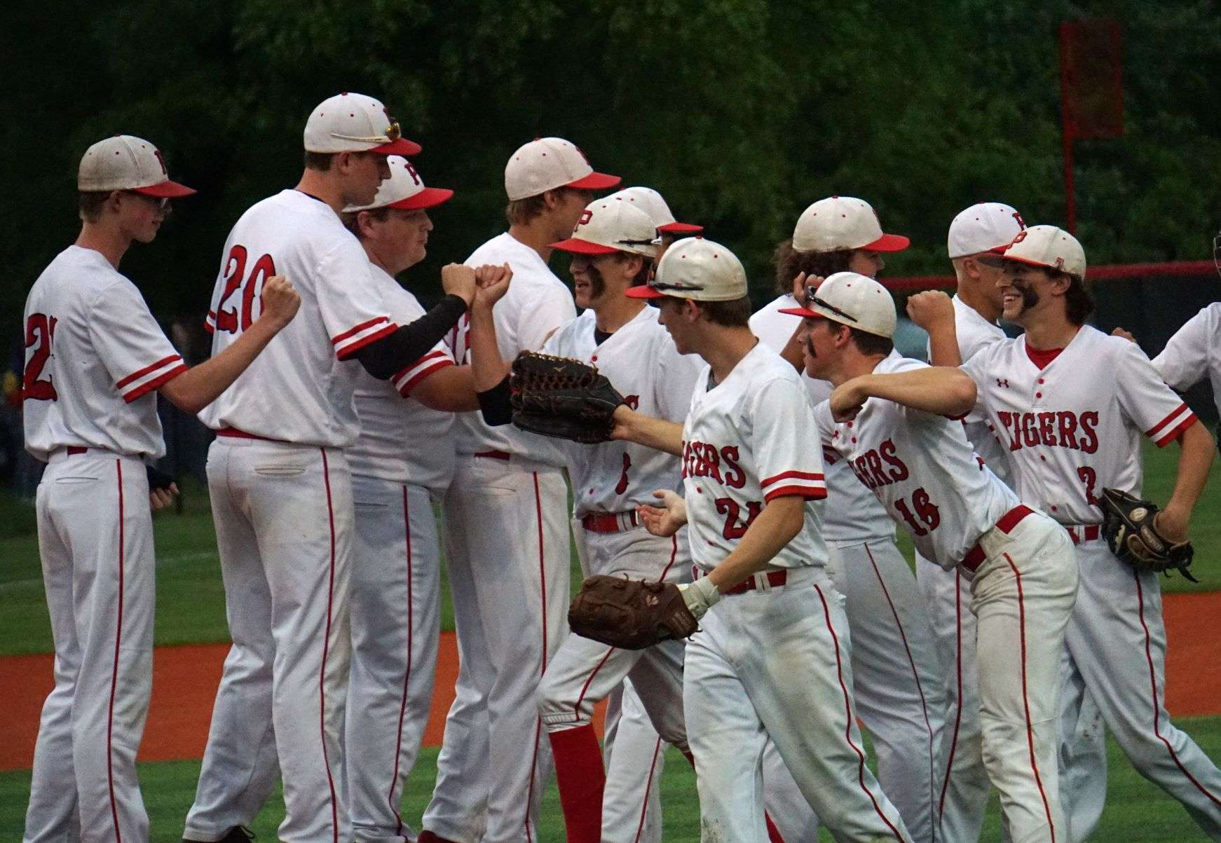 The Plattsburg baseball team celebrates after defeating Winsdor 9-0 in Wednesday's Class 2 quarterfinal game at Perkins Park. Photo by Tommy Rezac.