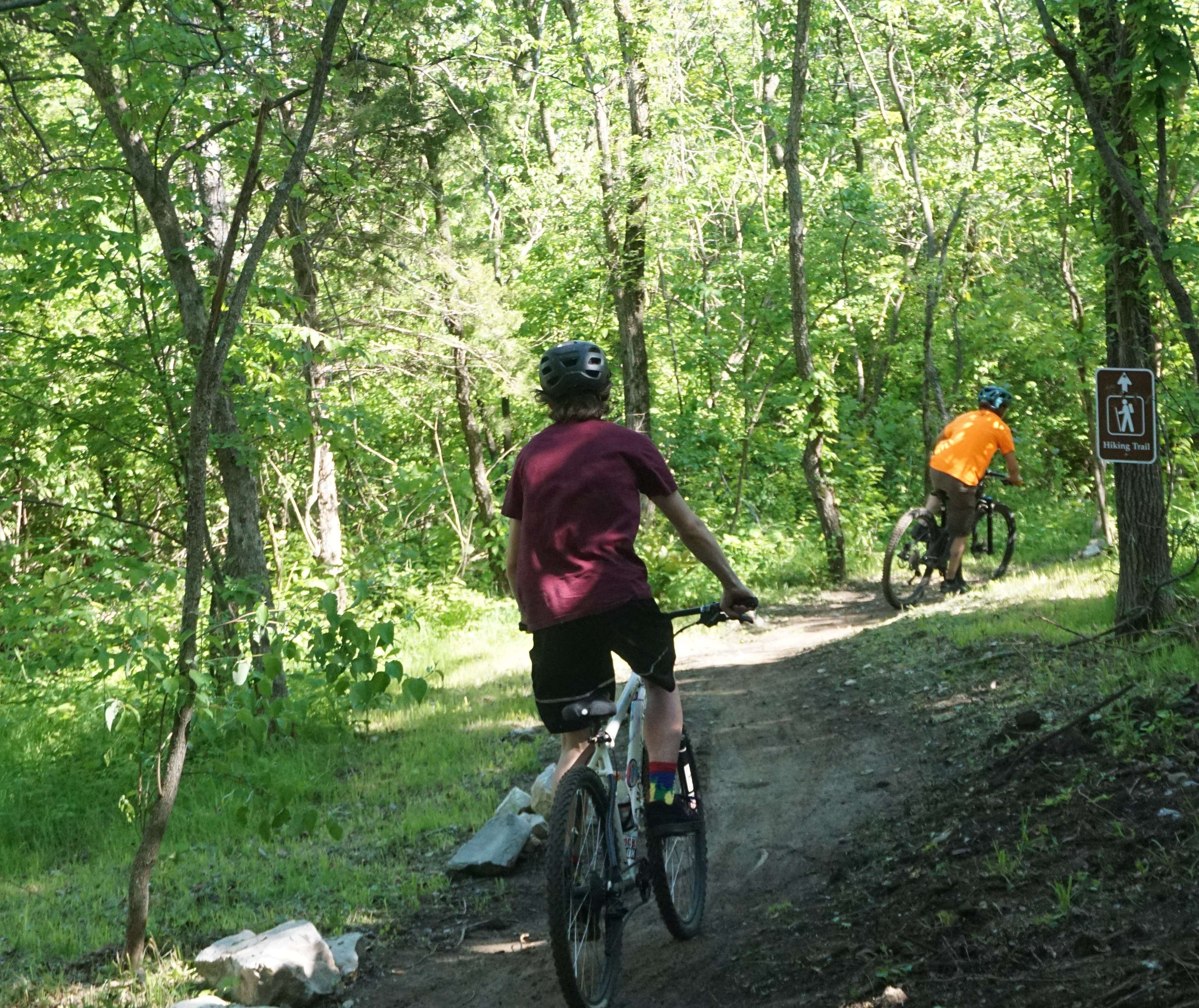 Bikers began their journey on the new trails in the River Bluff Trails Park following the ribbon cutting Friday/Photo by Matt Pike