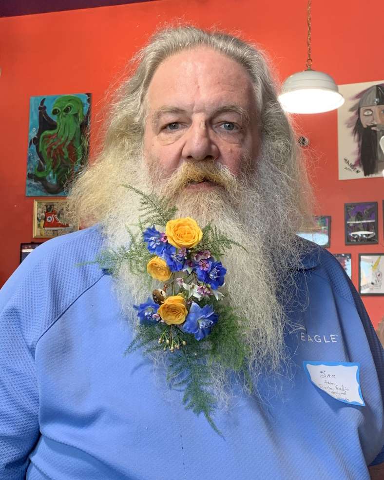 Sam Pridey wore a lovely floral bouquet designed by Wayne DeBey.