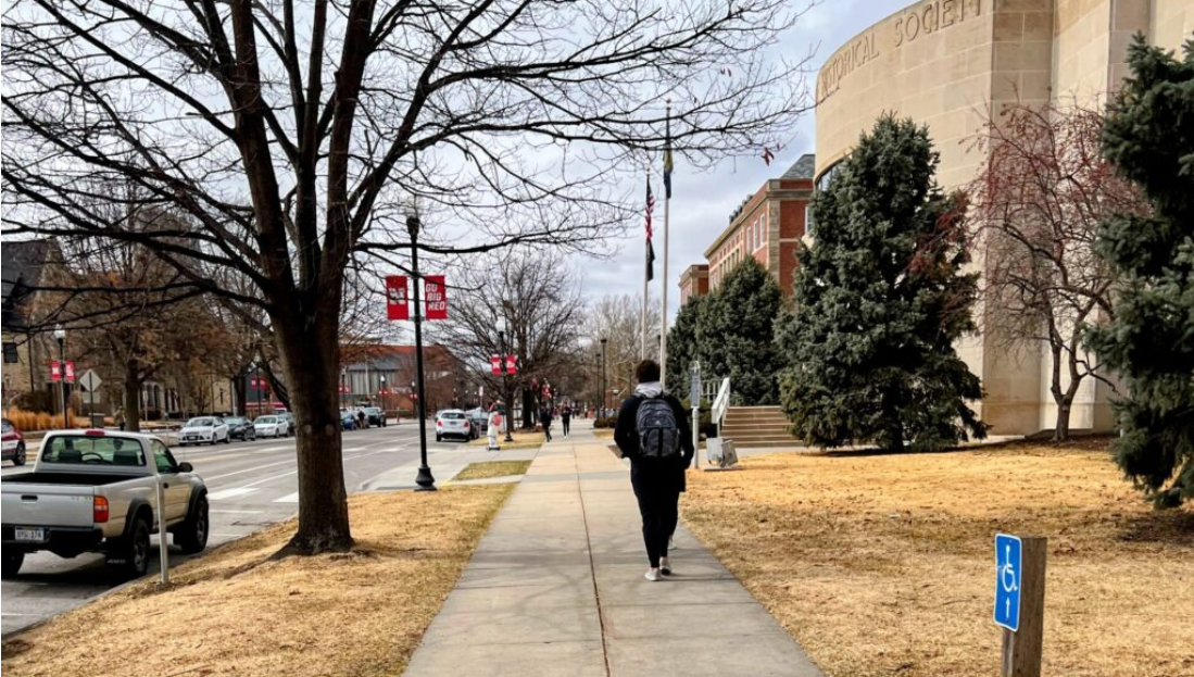 A student walks by the headquarters building of History Nebraska in Lincoln. (Aaron Sanderford/Nebraska Examiner)