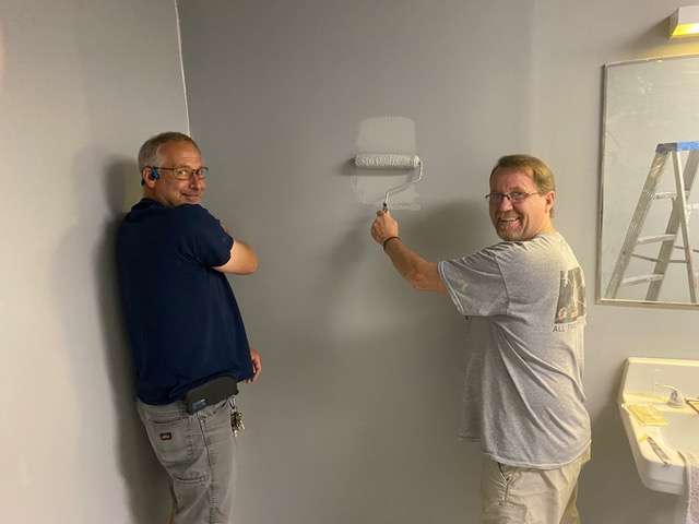 Willie Ayers, left, and Randy Greathouse paint a bathroom as part of a remodeling project at Sunflower Diversified Services. Community Habilitation Services moved to the main Sunflower location near the Great Bend Airport.