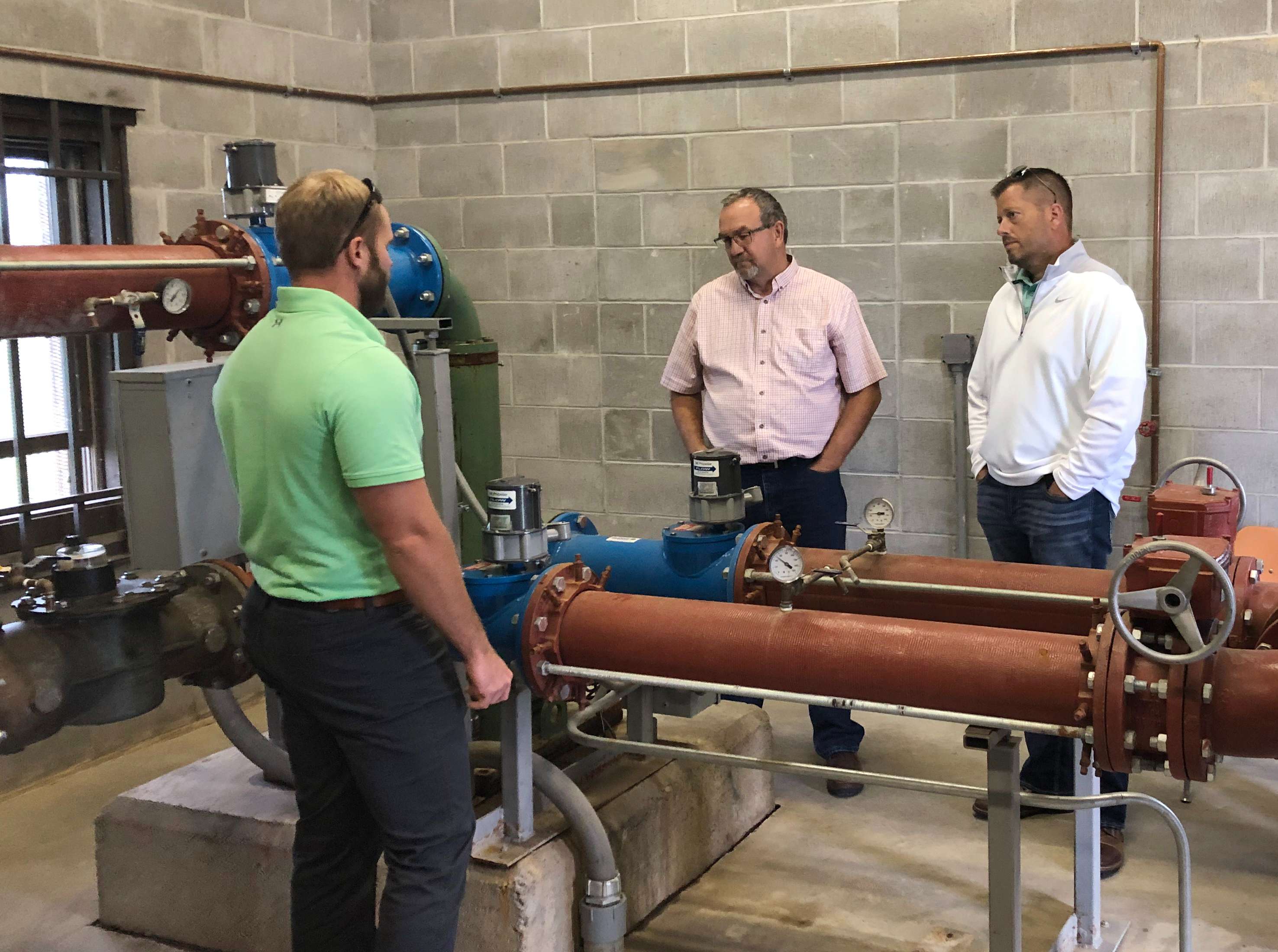 

Central Platte NRD ManagerLyndon Vogt, center, and Lower Niobrara NRD Assistant Manager Wade Ellwanger, right, visit Hastings Utilities to learn about their unique process for treating the city’s drinking water, which has high nitrate levels.

