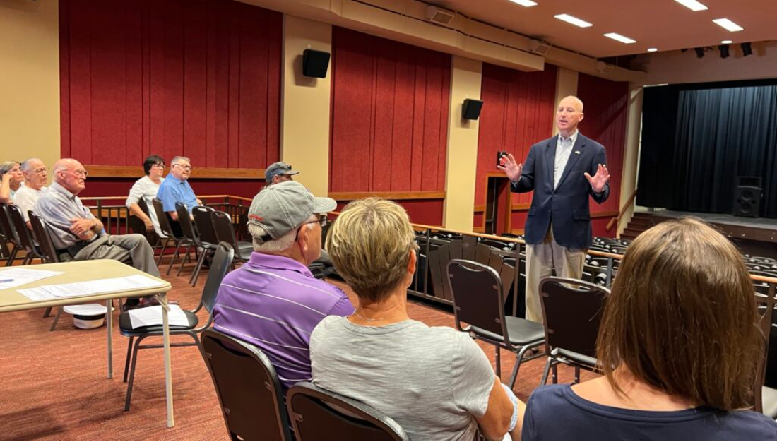 Gov. Pete Ricketts speaks to people in Wayne, Nebraska, who gathered to hear more about a petition drive the governor supports that would require people present ID in Nebraska to vote. (Aaron Sanderford/Nebraska Examiner)