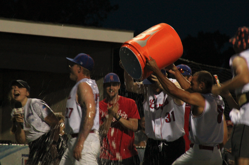 Leo Jiminian gives Luuk ter Beek a ice cold water bath as he is getting interviewed. Photo by Cayden Sanders, Tiger Media Network