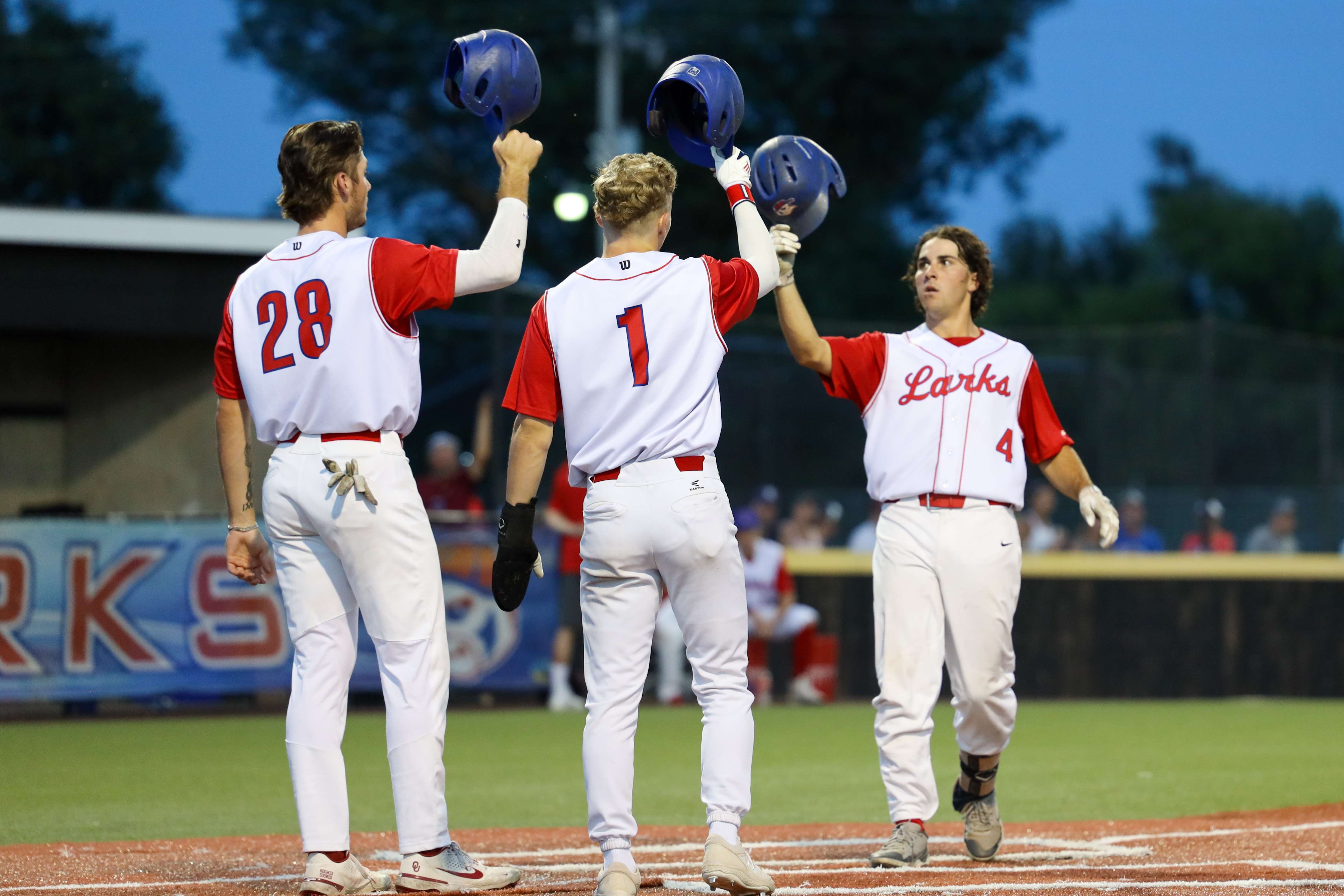 Larks second baseman Ben Fierenzi is congratulated at home plate after hitting a 3-run homer vs. Colorado Springs Sunday at Larks Park (Cayden Sanders)