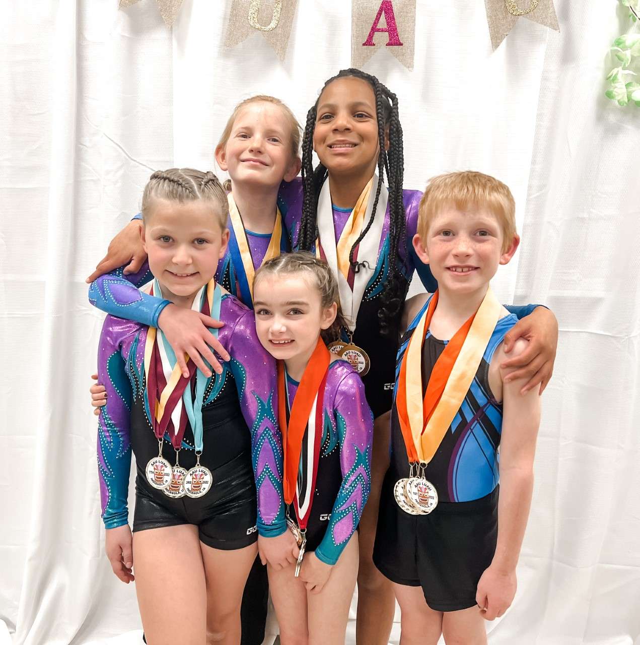 T&amp;T Team (front row: Madelyn; back row [l to r] Siena, Lauren Jenajiah, &amp; William) is heading to USAA Junior Olympic Games