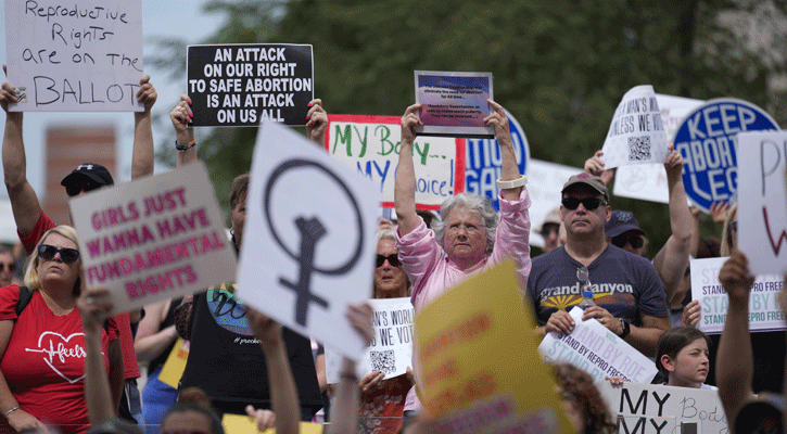 Abortion-rights activists rally at the Indiana Statehouse following Supreme Court's decision to overturn Roe v. Wade, on June 25, 2022 in Indianapolis. The lawyer for an Indiana doctor who has found herself at the center of a political firestorm after revealing the story of a 10-year-old girl who traveled from Ohio for an abortion says her client provided proper treatment. (AP Photo/AJ Mast, File)