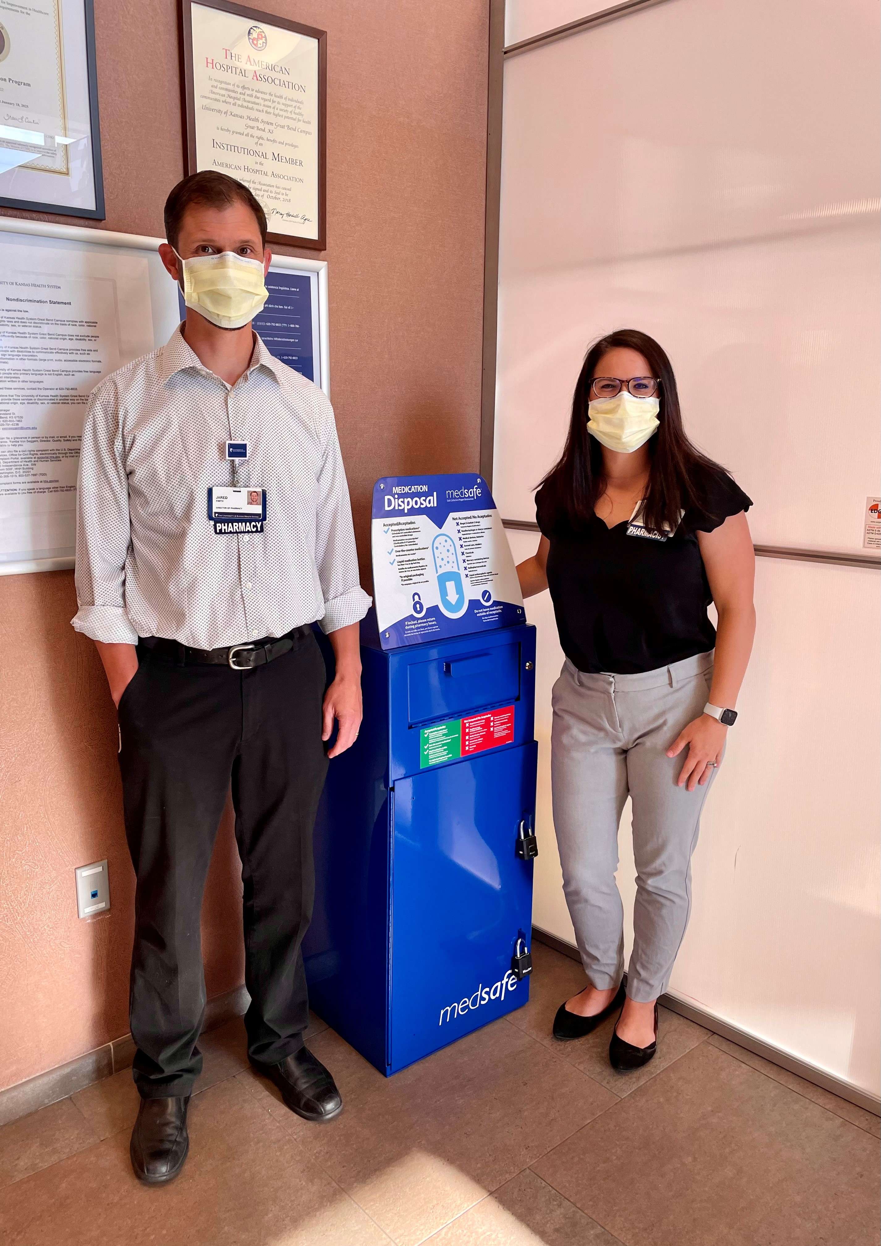 The medication disposal bin was proposed by Paige Nordman, pharmacist (pictured at right), and supported by Jared Smith, director of pharmacy (pictured at left).