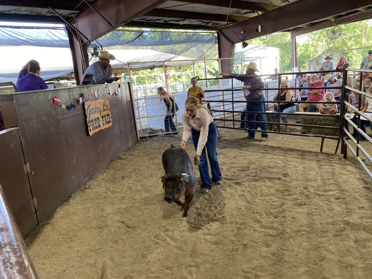 Tava Gustafson with her grand champion market hog.