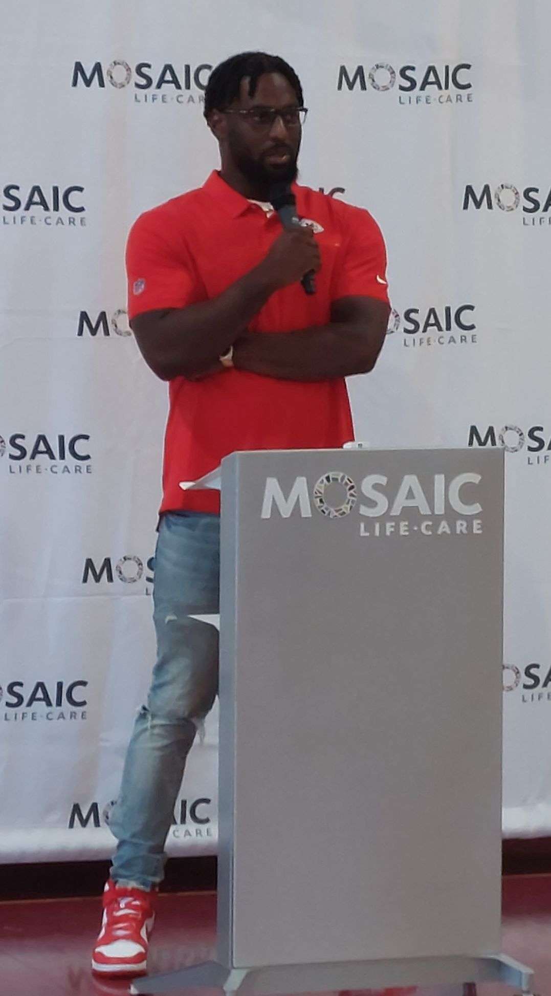 Elijah Lee at the podium at the Bartlett Center being announced as this year's Mosaic player sponsor/Photo by Matt Pike