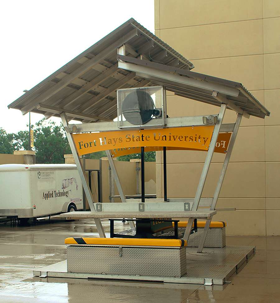 FHSU created this charging station as a research project. Electricity is generated through solar energy from panels on top of the station, as well as from mechanical energy when the swing is in motion. Photo by Cristina Janney/Hays Post<br>