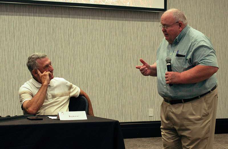 Duane Keller, left, speaks will Walt Hill, director of High Plains Mental Health Center, during a panel Thursday on ag and mental health. Keller lost his home and his farm burned during the Four Counties Fire in December. Photo by Cristina Janney<br>