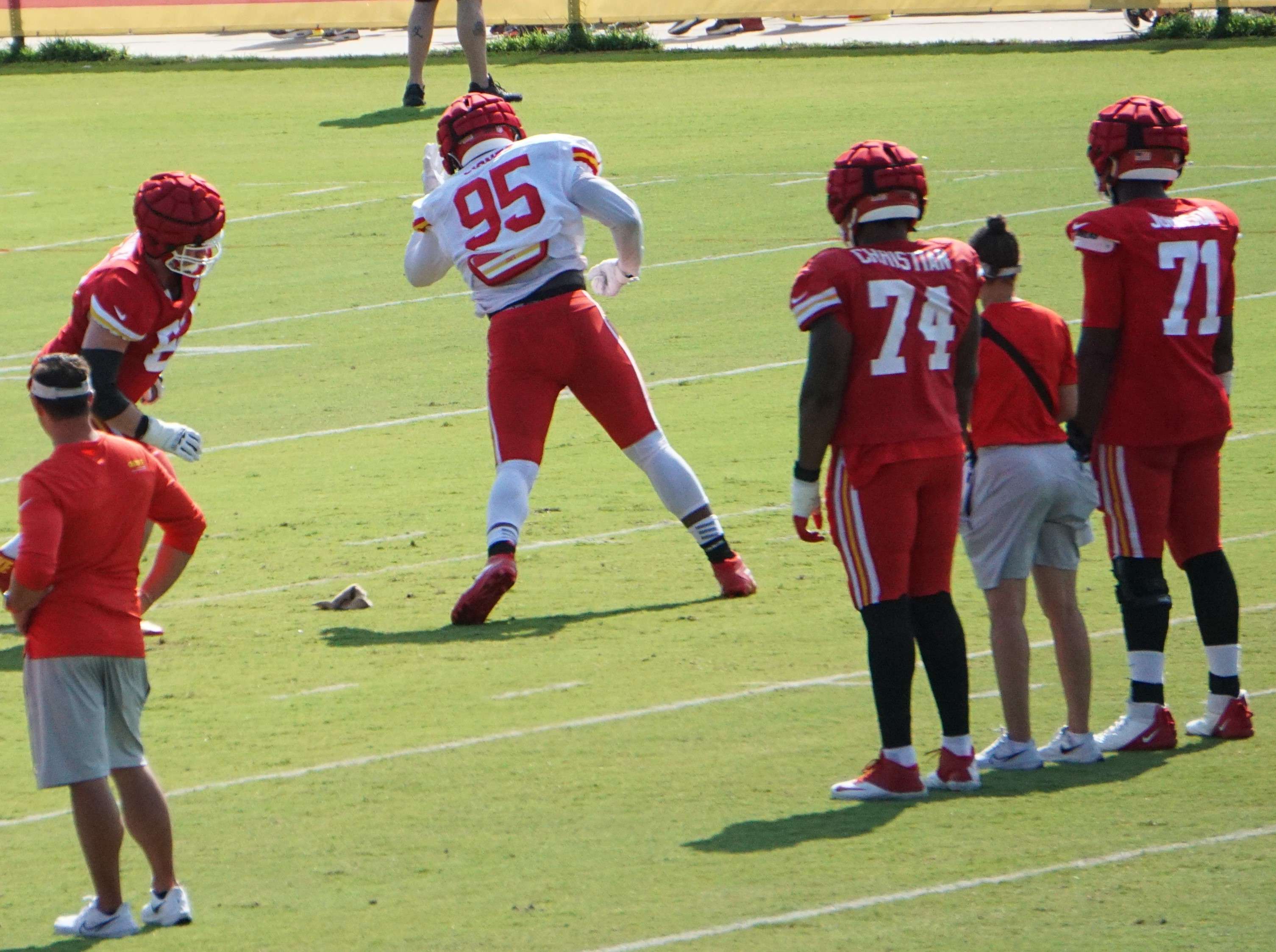 Chris Jones (95) and Joe Thuney (left, red) in one-on-one linemen drills.