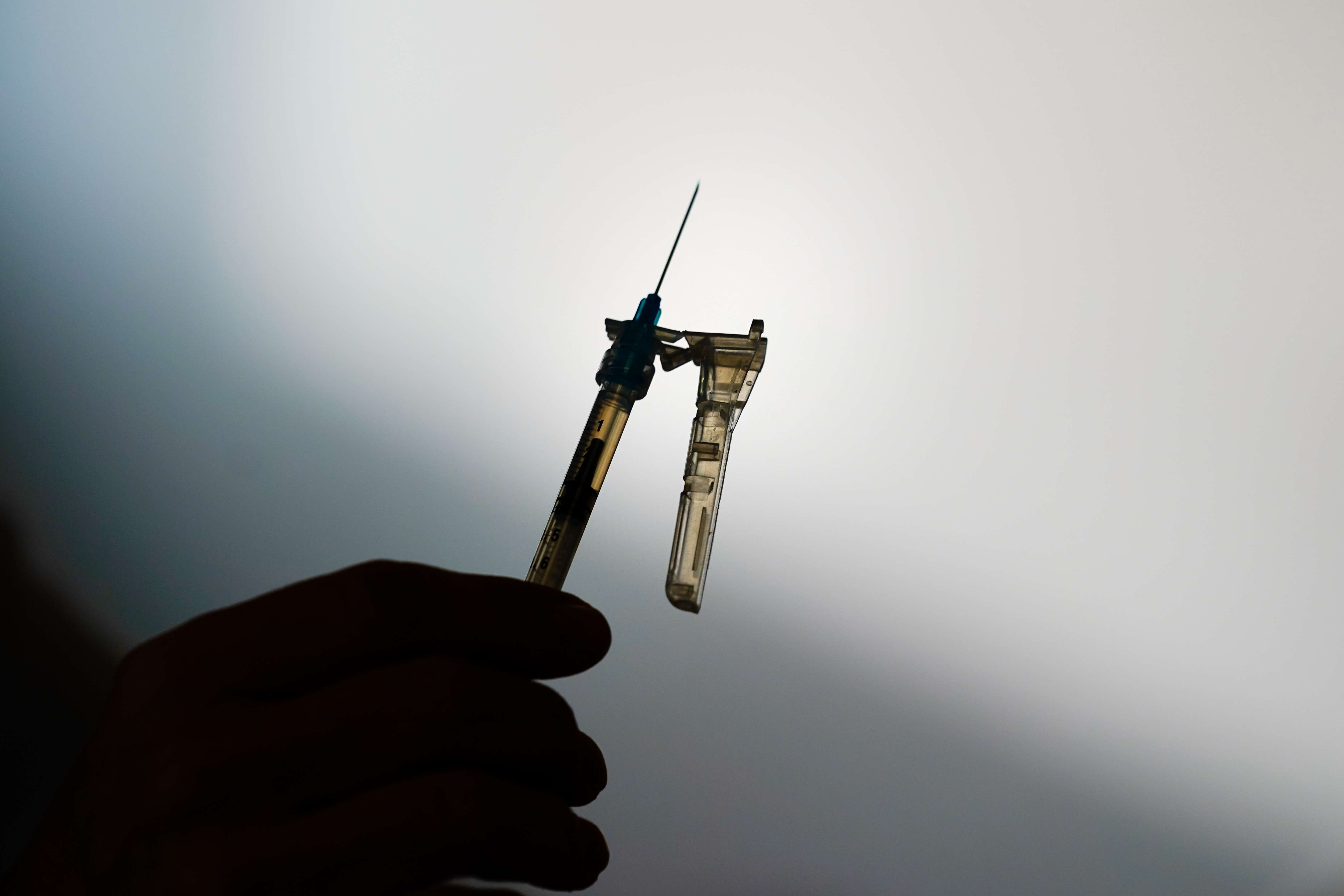 A syringe is prepared at a clinic in Norristown, Pa., Dec. 7, 2021. The Environmental Protection Agency is warning residents in 13 states and Puerto Rico about potential health risks from emissions of ethylene oxide, a chemical widely used to sterilize medical equipment and decontaminate spices. (AP Photo/Matt Rourke, File)