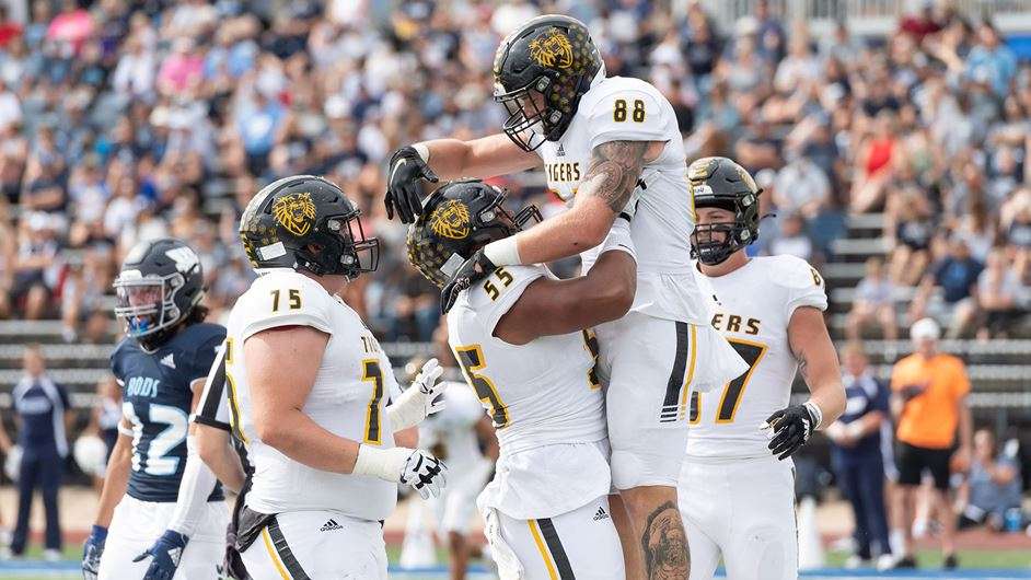 FHSU's TE Hunter Budke and C Senituli Teuhema celebrate a touchdown last season at Washburn. (Courtesy FHSU Athletics, Ryan Prickett)
