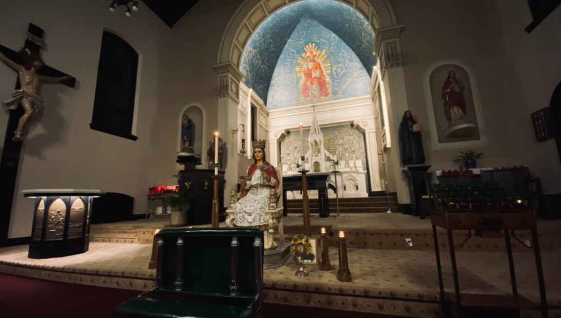 Santa Lucia statue at the festival ‘s overnight adoration, where devotees take shifts guarding her until the Sunday worship service at St. Frances Cabrini Church. (Courtesy of Charlie Venditte)