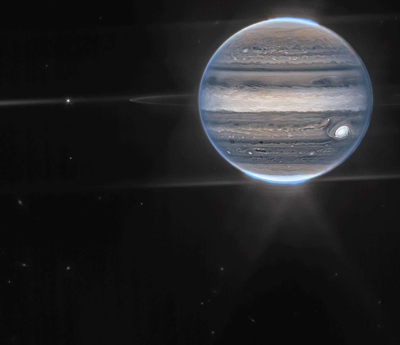 This image provided by NASA shows a false color composite image of Jupiter obtained by the James Webb Space Telescope on July 27, 2022. The planet’s rings and some of its small satellites are visible along with background galaxies. (NASA via AP)