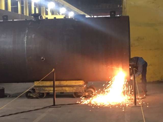 Here, a welder works on the inside of a boiler. Manual welding is a major part of Superior's operations.