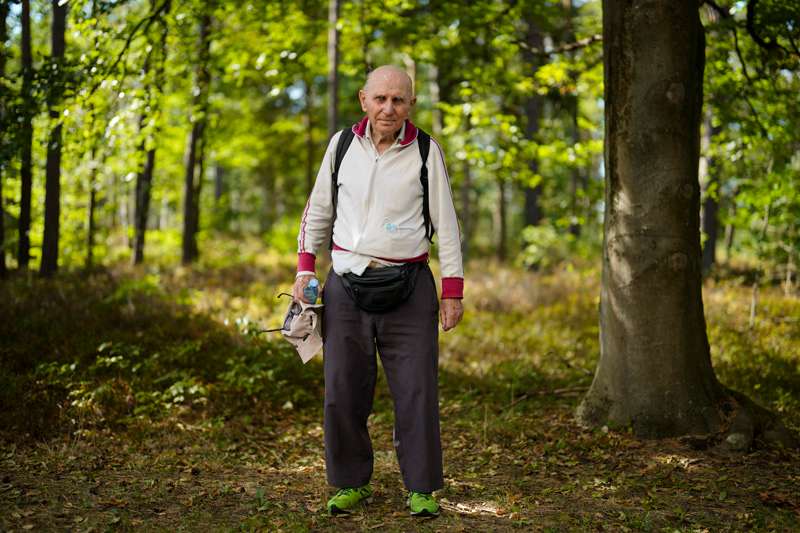 <b>Israeli Olympic racewalker Shaul Ladany poses for a photo after an interview with The Associated Press at the former Nazi concentration camp Bergen-Belsen in Bergen, Germany, Saturday, Sept. 3, 2022. Shaul Ladany survived a Nazi concentration camp and narrowly escaped the massacre of the Israeli athletes at the 1972 Olympic Games in Munich. Both attempts to murder him happened on German soil in the last century. Many decades later, the 86-year-year old Jew has returned to visit the two places where he narrowly escaped death.</b> (AP Photo/Markus Schreiber)