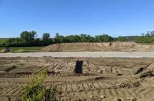 A pile of dirt (in the background) is all that remains of a small plot of virgin prairie in northwest Omaha, along State Street just west of Nebraska Highway 133. (Courtesy Tom Bragg)