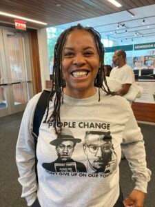 Yshall Davis, a volunteer at the Malcolm X Foundation, wiped tears after Malcolm X was voted into the Nebraska Hall of Fame. (Paul Hammel/Nebraska Examiner)