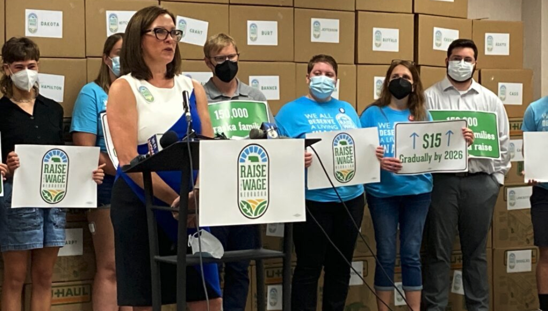 Kate Wolfe, campaign coordinator for Raise the Wage Nebraska, speaks as the initiative prepares to submit 160,000 petition signatures on Thursday. (Paul Hammel/Nebraska Examiner)
