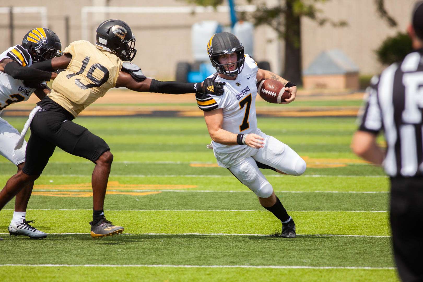 Missouri Western quarterback Reagan Jones (7) tries to get away from a defender in the Griffons' 36-12 loss at Emporia State Saturday. Photo by Arianne Boma.