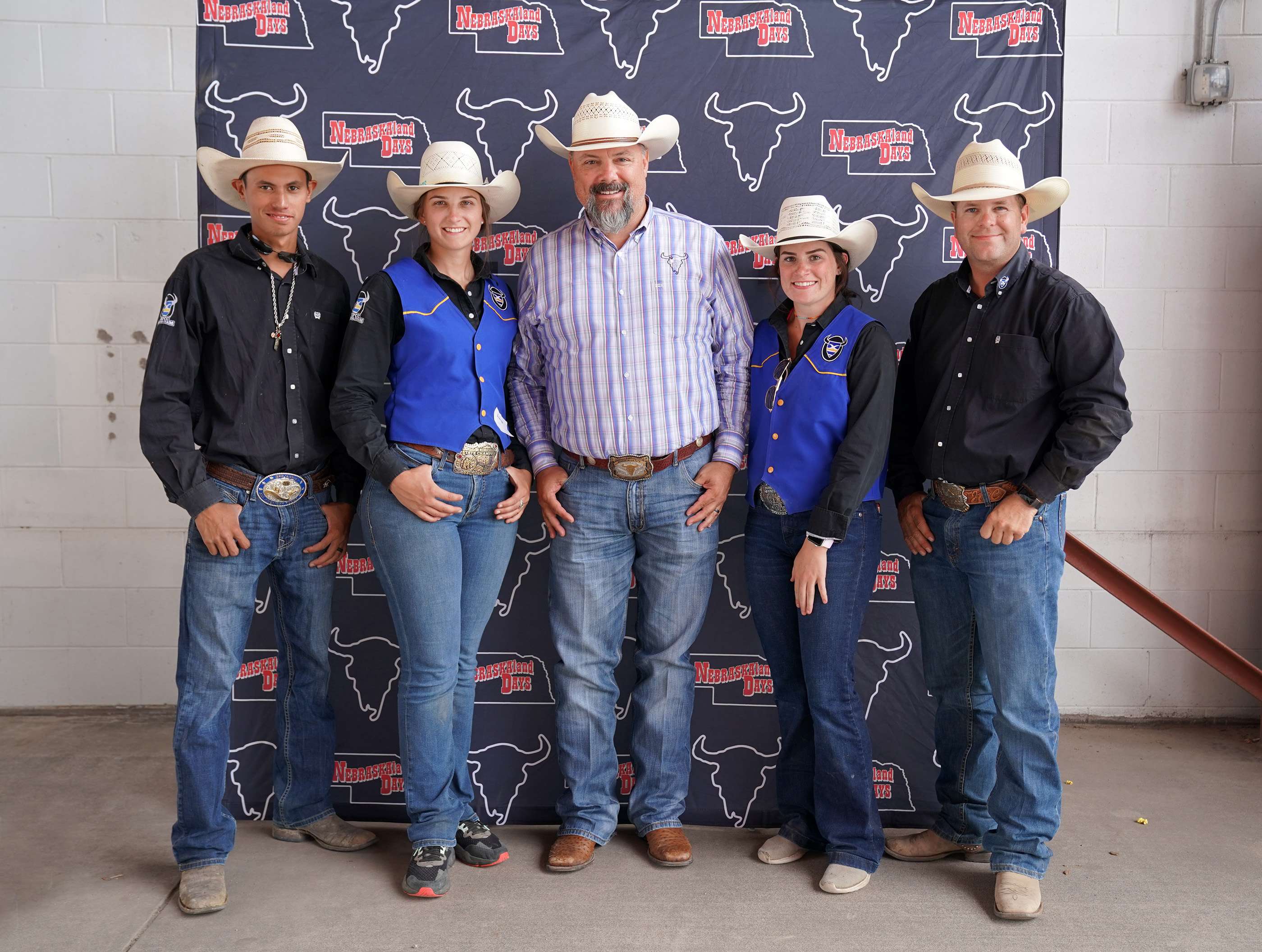 <i>Mid-Plains Community College Rodeo Team members Andrea Meyer and Maggie Underhill were presented with $900 scholarships from NEBRASKAland Days Saturday night during the MPCC Stampede. Pictured to left to right are: Aukai Kaai, MPCC Rodeo Team roughstock coach; Meyer; David Fudge, NLD executive director; Underhill and Wyatt Clark, MPCC Rodeo Team timed event coach.</i>