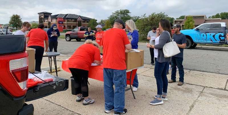 <b>People lining up to register to help find a match for Calvin just after noon Friday at the Eagle Radio studios, 1825 S. Ohio. It only takes a few minutes!</b> Salina Post photo