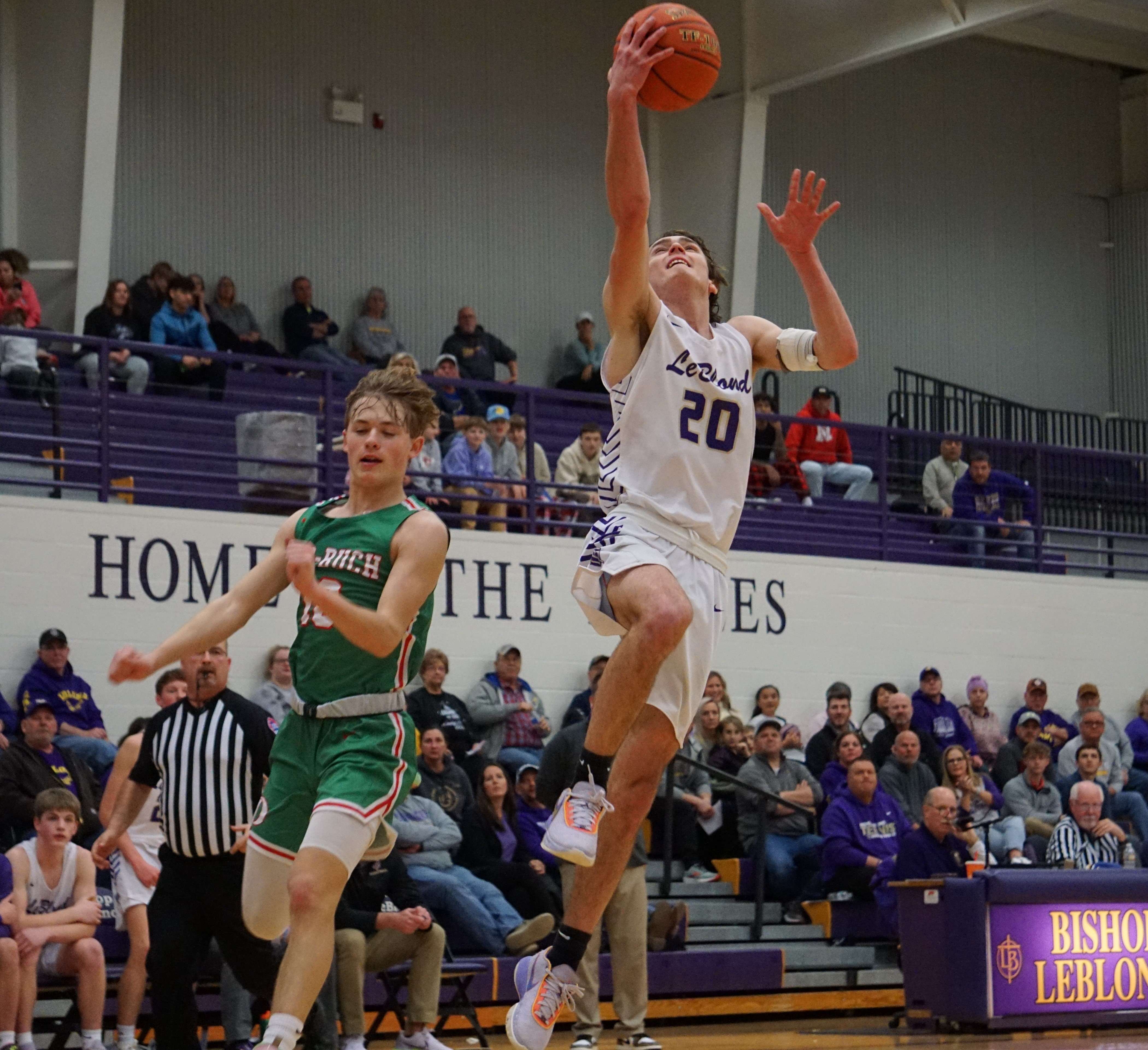 Jake Korell (20) goes up for a layup.