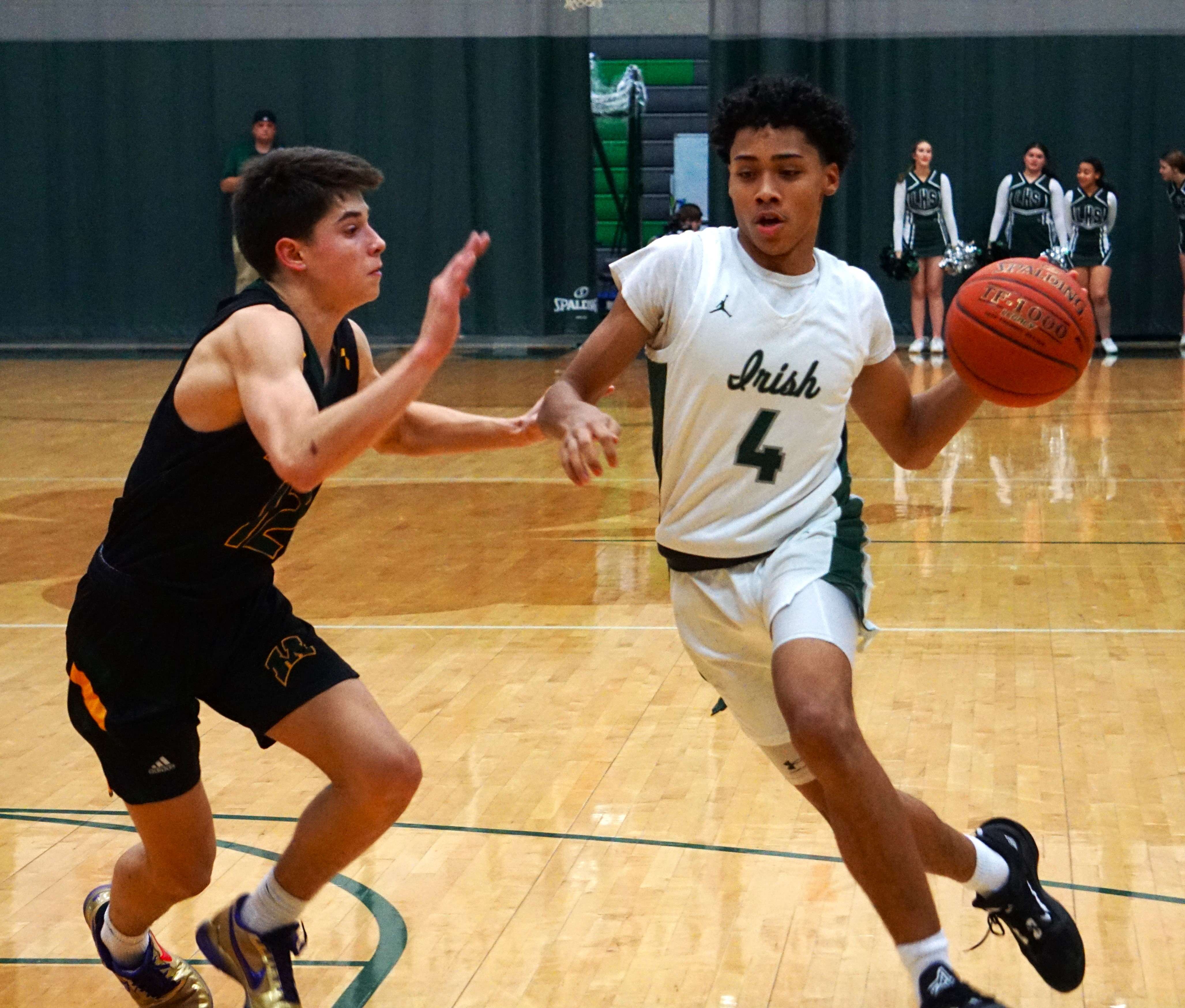 Lafayette's Antonio Williams (4) dribbles in the first half of Thursday's game against Maryville. Photo by Tommy Rezac.