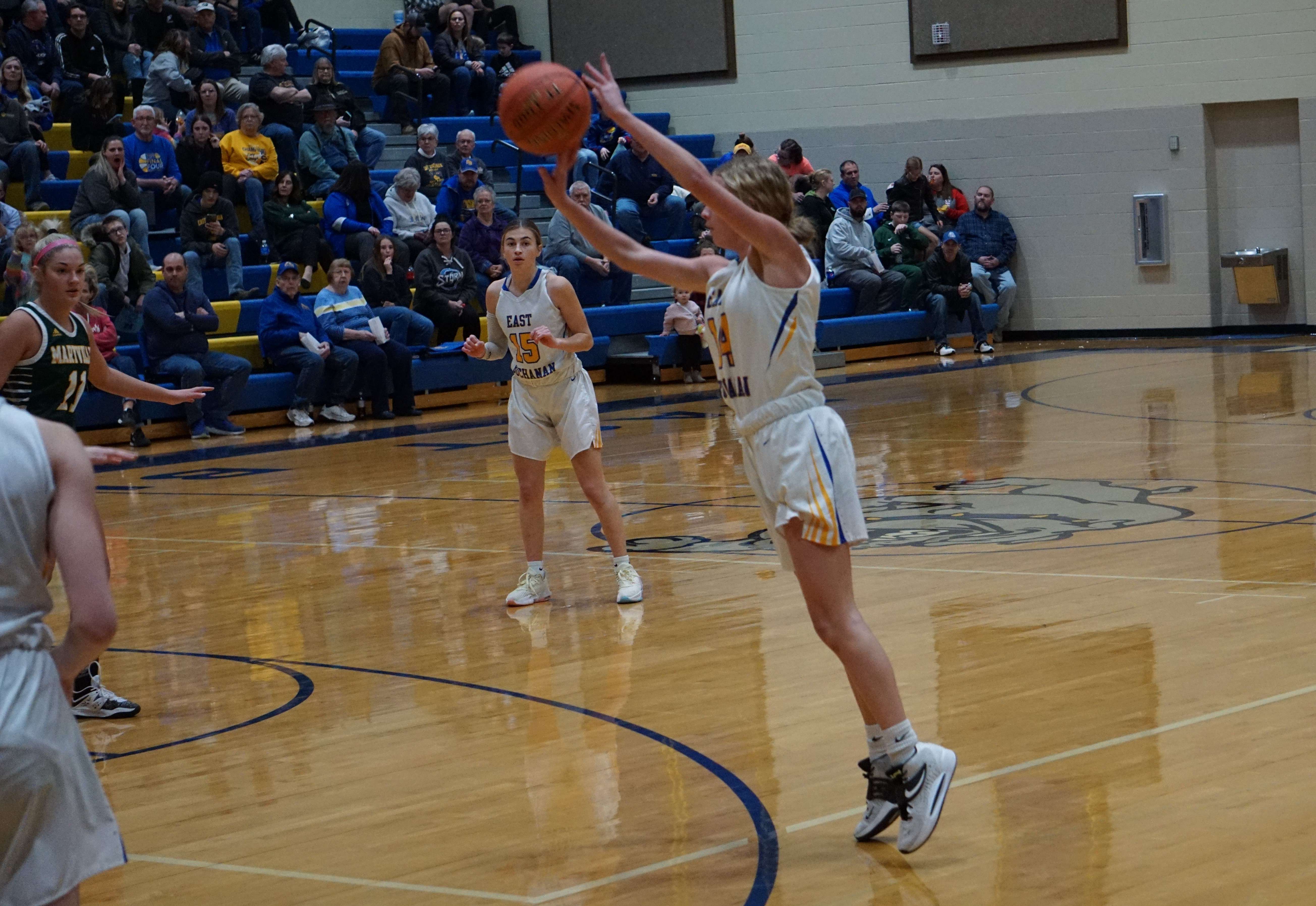 Junior Angelina Engnes takes a three point shot, one of two she hit early in the first quarter/ Photo by Matt Pike